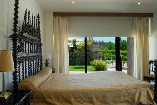 Postel nebo postele na pokoji v ubytování Quinta do Mosteiro