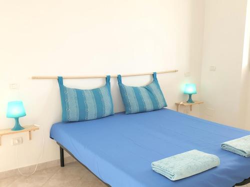 Кровать или кровати в номере Ville Torre del Pizzo