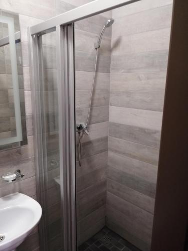 a bathroom with a shower and a sink at Centralnyi hotel in Poltava