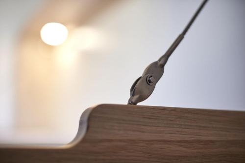 a pair of scissors sitting on top of a piece of wood at Radhotel am Gleis in Radolfzell am Bodensee