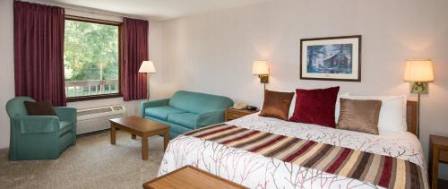 Katil atau katil-katil dalam bilik di Highland Manor Inn