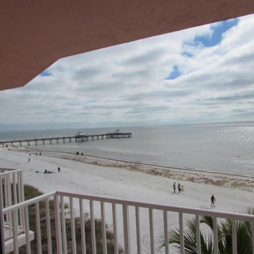 a view of a beach with a pier at Edison Beach House in Fort Myers Beach