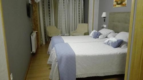 Ένα ή περισσότερα κρεβάτια σε δωμάτιο στο Via Stellae