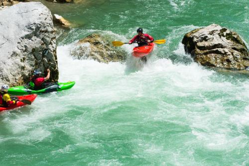 a group of people in kayaks in a river at Haus Central Lofer in Lofer