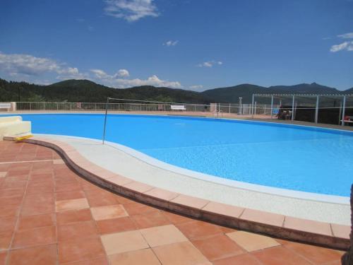 a large blue swimming pool on top of a building at Bastidon "Capitou" in Fréjus