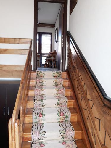 a stairway with a flower carpet on it at Villa Domina in Gevgelija