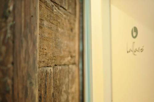 a close up of a brick wall next to a door at Ai Tre Mercati in Palermo