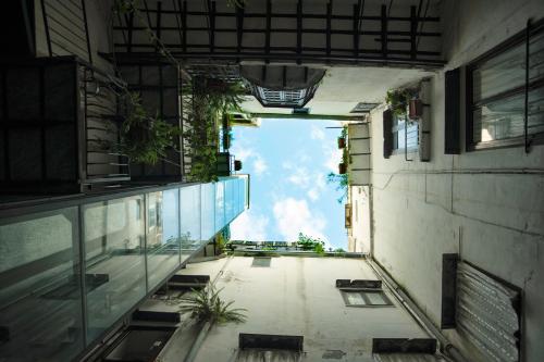 an empty hallway of a building with a view of the sky at Ai Tre Mercati in Palermo