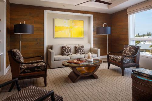 a living room with a couch and two chairs and a table at The Residences on Siesta Key Beach by Hyatt Vacation Club in Sarasota