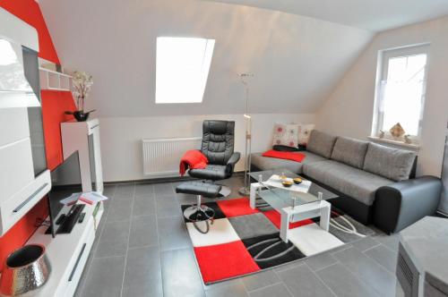 O zonă de relaxare la Ferienhaus Müritzidyll / OG-Appartement