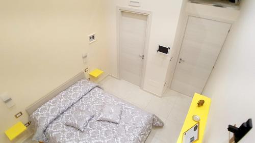 a white bedroom with a bed and a closet at ManfredoniaJacuzzi in Manfredonia