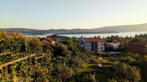 a view of a town with a river and a city at Apartmani Bosco in Tivat