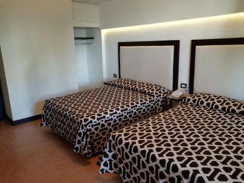 Кровать или кровати в номере Hotel Essen's