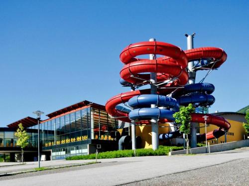 a water slide in front of a building at Ferienwohnung Kirschner in Fügenberg