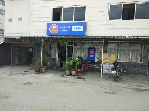 a motorcycle parked in front of a building at MSR Lodge in Tirupati