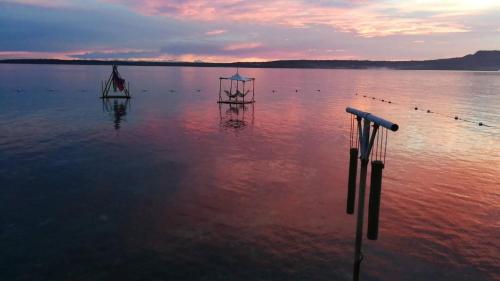 a large body of water with two boats in it at Jelly Sea Resort in Siquijor