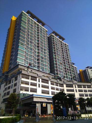 a tall building with a lot of windows at Shah Suites Vista Alam in Shah Alam