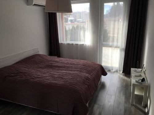 A bed or beds in a room at ApartVel apartment 1