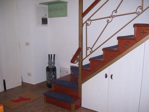 a staircase in a room with a stair case at LITTLE TOWER in Aielli