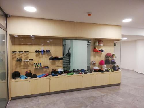 a display case in a store filled with shoes at Hotel SOREA SNP in Demanovska Dolina