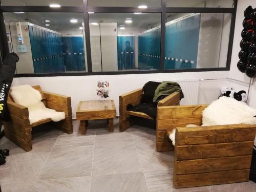 a room with wooden furniture and a mirror at Hotel SOREA SNP in Demanovska Dolina