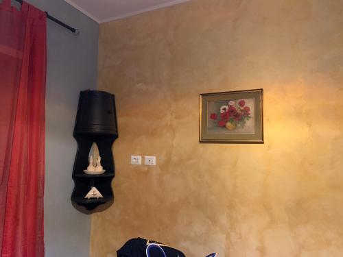 a room with a picture of fruit on the wall at FiumicinoA57 in Fiumicino