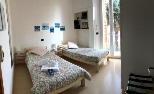 Krevet ili kreveti u jedinici u objektu B&B Il Poeta sul Mare