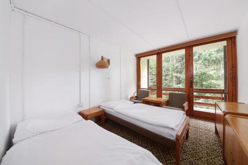 Postel nebo postele na pokoji v ubytování Hotel Medlov Depandance