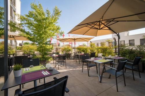 Un restaurante u otro lugar para comer en ibis Lausanne Crissier