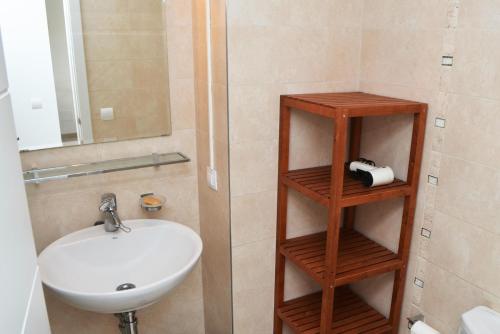 a bathroom with a sink and a mirror at Casa Andersen in Port de Pollensa