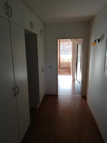 an empty room with a door and a hallway at Hotel Ideal in Lübeck