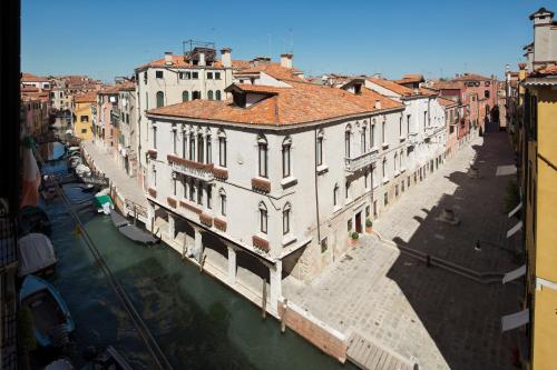arial view of a city with a river and buildings at Maison Venezia | UNA Esperienze in Venice