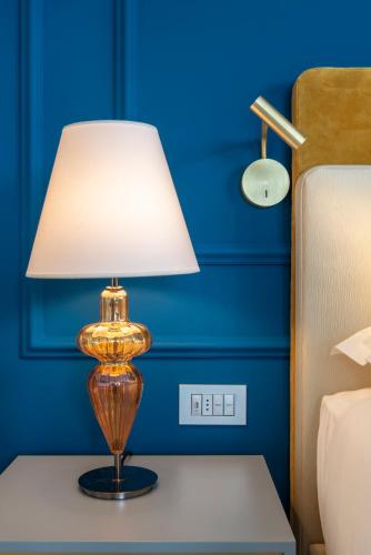 H10 Palazzo Canovaにあるベッド