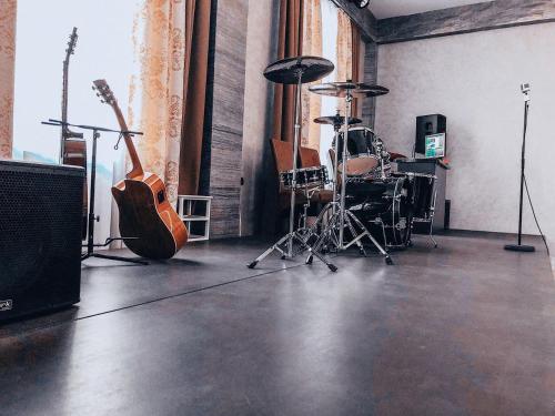 a recording room with guitars and drums in it at Отель БЕССАРАБИЯ in Izmail
