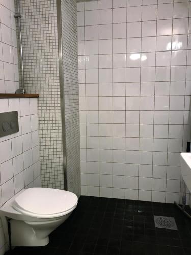 a bathroom with a toilet and a sink at Hostel Dalagatan in Stockholm