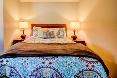 a bedroom with a bed with two lamps on both sides at Cabana #11 in Chelan