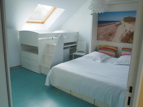 a white bedroom with a bed and a window at Hôtel Le Vivier WISSANT - Centre Village - Côte d'Opale - Baie de Wissant - 2CAPS in Wissant