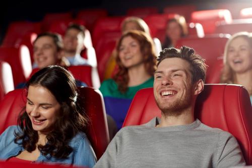 a group of people sitting in a movie theater at Macdonald Woodland Lodges at Macdonald Aviemore Resort in Aviemore