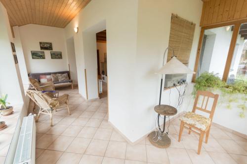 a living room with a table and chairs at Holiday House Vitice 21 in Vitice