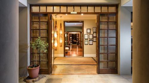 a hallway with a door leading into a house at Manor 38 in Port Elizabeth