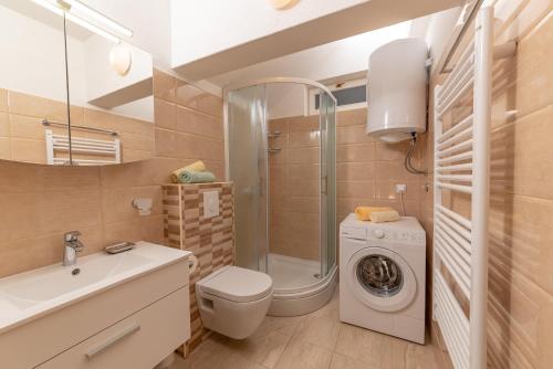 Ванная комната в Apartman Hibiskus