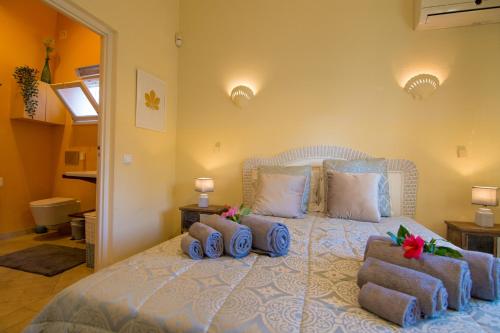a bedroom with a bed with three pillows on it at villa yvonne,private pool,private parking 1,7 km from the beach in Albufeira