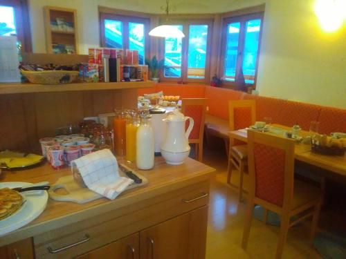 a kitchen with a table with food on it at Haus Kleineisen by Châtel Reizen in Zell am See