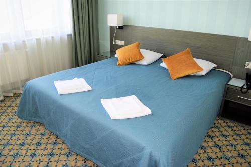 
Кровать или кровати в номере Zavidovo Resort
