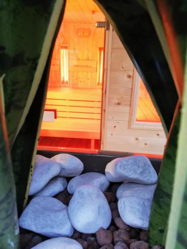 a view of a room with rocks and a small house at Hotel Dolce Vita in Balatonkenese