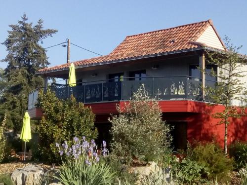 a house with a wrap around porch at Homgaïa chambres d'hôtes in Clisson