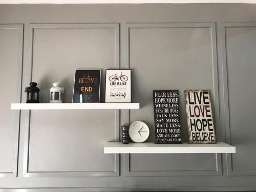 a shelf with books on it in a room at LEPAK-LEPAK HOMESTAY @ INDERA MAHKOTA in Kuantan