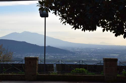 a street light with a view of a city at Hotel Ristorante Guardanapoli in Cervino
