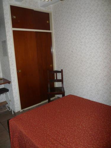 Ένα ή περισσότερα κρεβάτια σε δωμάτιο στο Hotel Cosme