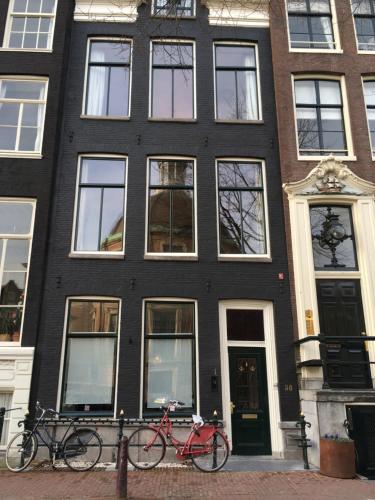 two bikes parked in front of a building at Kangaroom in Amsterdam